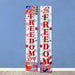 Two vertical banners with 'Let Freedom Ring' text on a blue wall.
