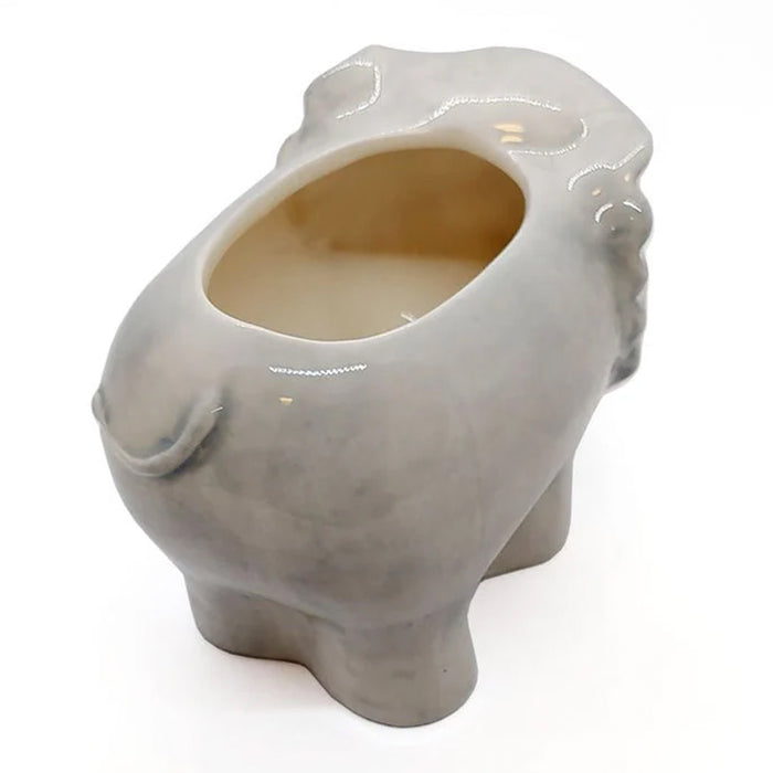 Ceramic elephant tiki on a white background