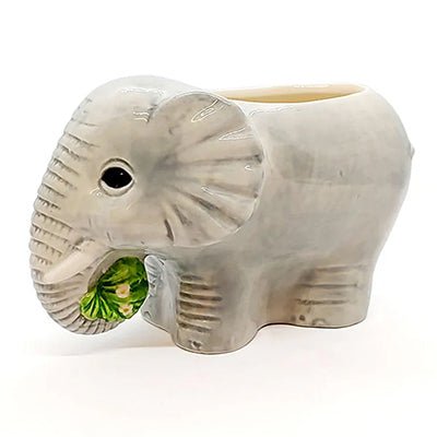 Ceramic elephant tiki on a white background
