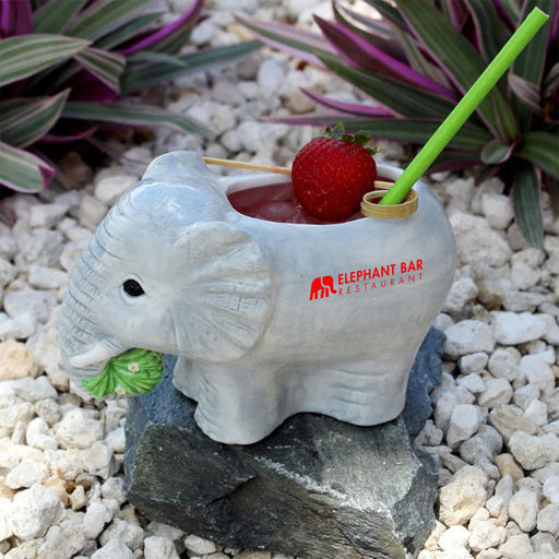 Ceramic elephant tiki on a white background