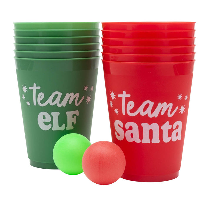 Green and red cups labeled 'Team Elf' and 'Team Santa' with two small balls on a white background.