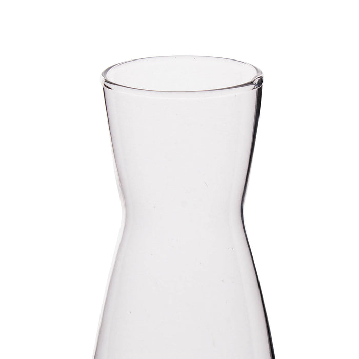 Clear glass carafe on a white background