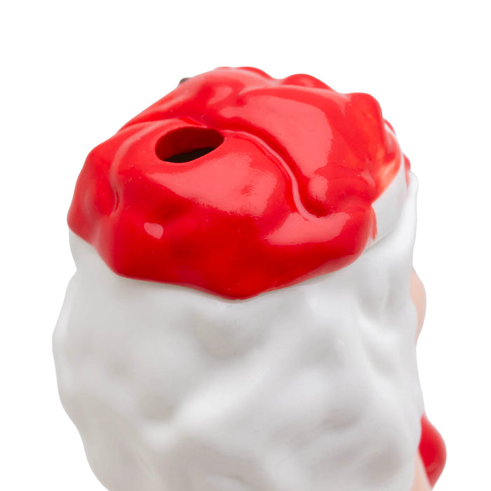 White ceramic ms. claus with a red hat 
