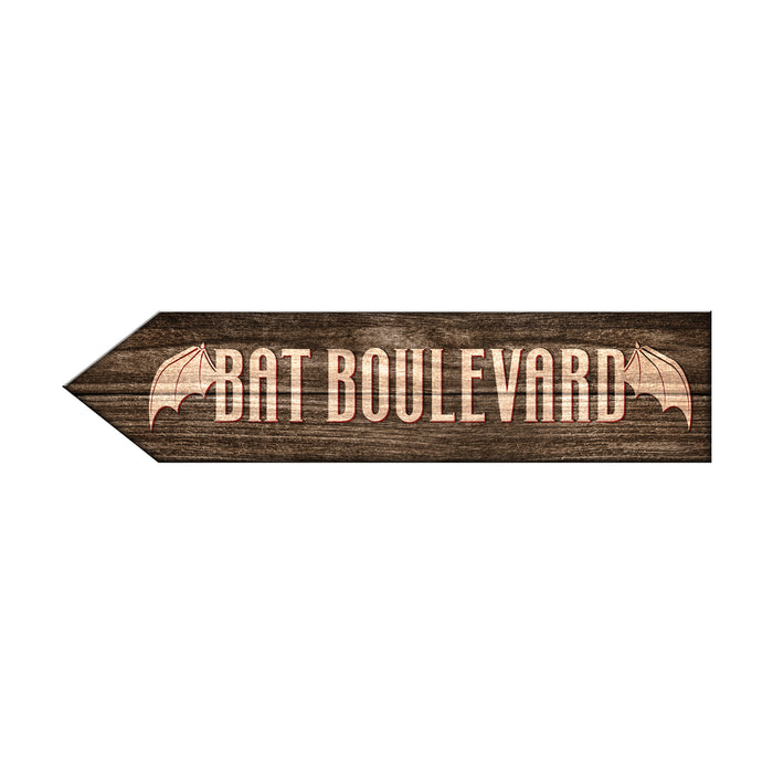 Wooden arrow-shaped sign with 'Bat Boulevard' text and bat designs on a white background