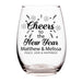 Clear glass wine glass with 'Cheers to the New Year' text and personalized names on a white background