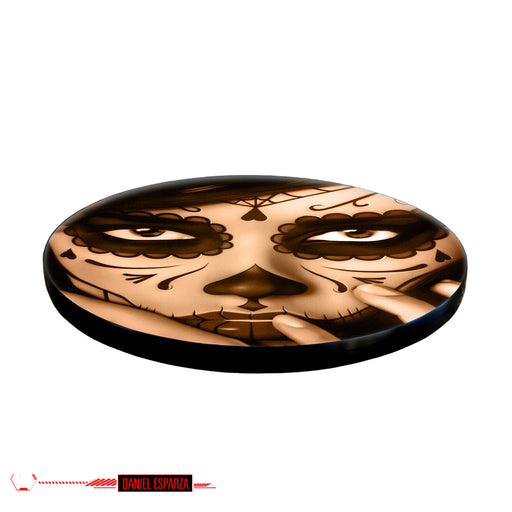 Decorative coaster with a skull design on a white background