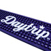 Daytrip logo on a purple textured background