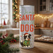 Tumbler with Christmas design featuring a dog and text in a kitchen setting.