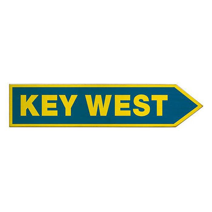 Directional sign pointing to 'Key West' with a blue background and yellow text.