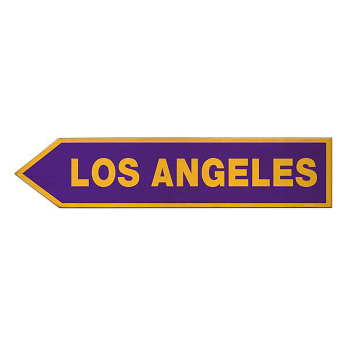 Directional sign pointing to Los Angeles with a purple background and yellow text.
