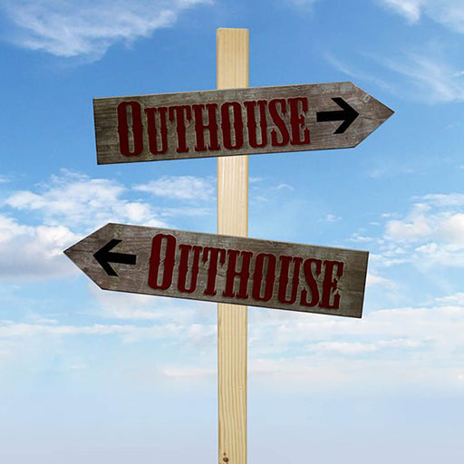 Wooden signpost with 'Outhouse' direction signs against a blue sky.