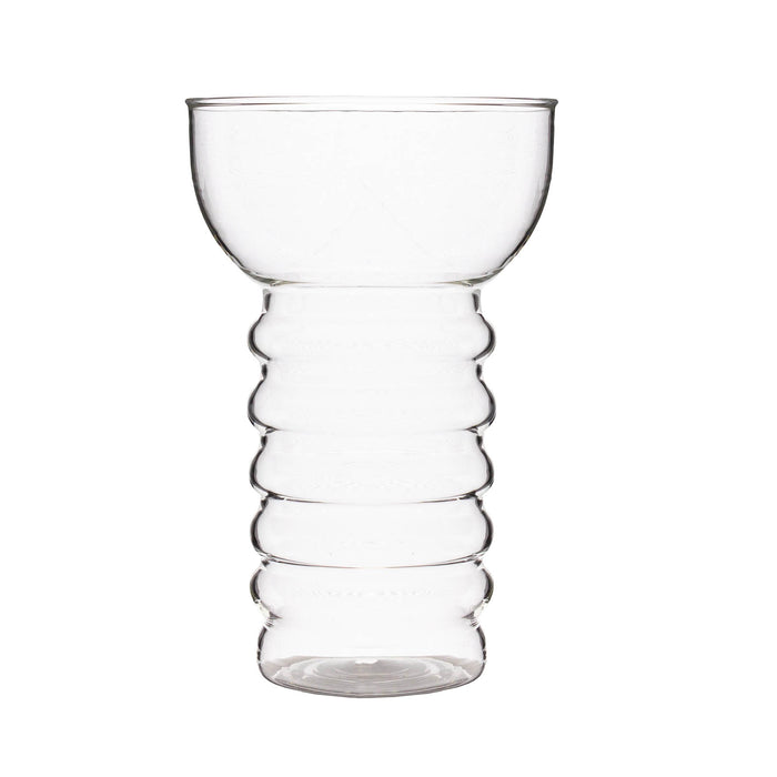 Clear glass vase with ribbed design on a white background