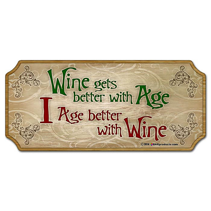 Wooden sign with decorative text 'Wine gets better with age, I age better with wine' on a white background.