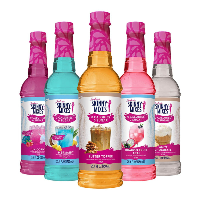 Five bottles of Skinny Mixes syrups with colorful labels on a white background