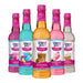 Five bottles of Skinny Mixes syrups with colorful labels on a white background