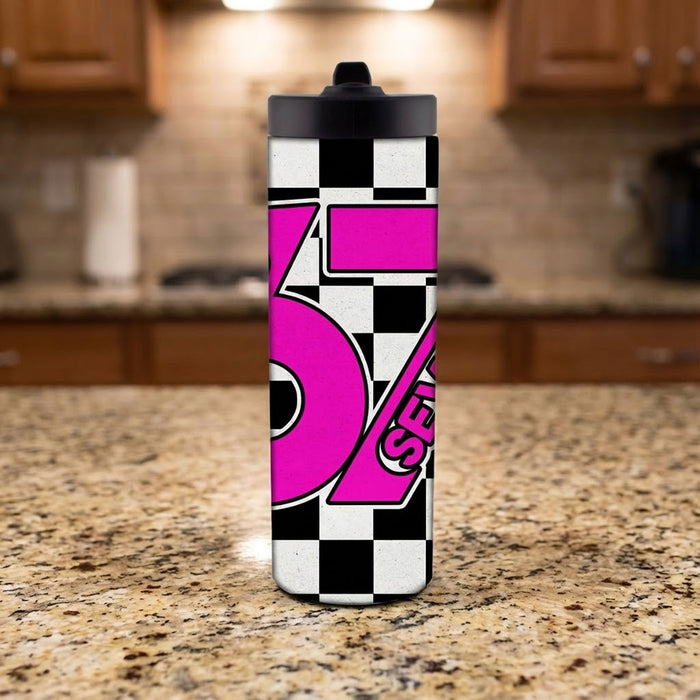 Tumbler with pink and black design on a kitchen counter