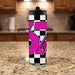 Tumbler with pink and black design on a kitchen counter