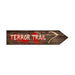 Wooden arrow sign with 'TERROR TRAIL' text and blood-like design on a white background