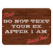 Wooden sign with text 'Do not text your ex after 1 AM' on a white background