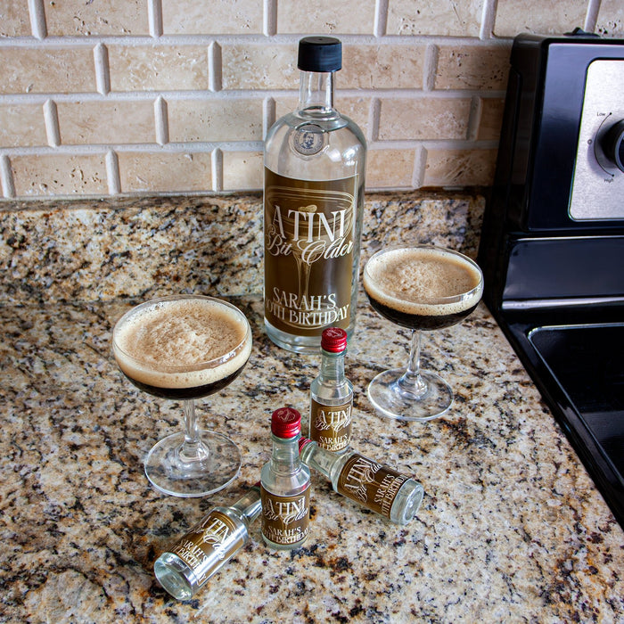 Bottles and glasses of Latini Gin on a kitchen counter with a tiled backsplash.