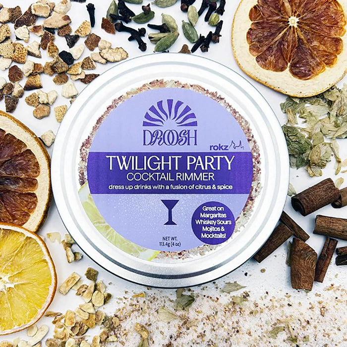 DAVOSH Twilight Party Cocktail Rimmer container surrounded by dried fruits and spices on a white background