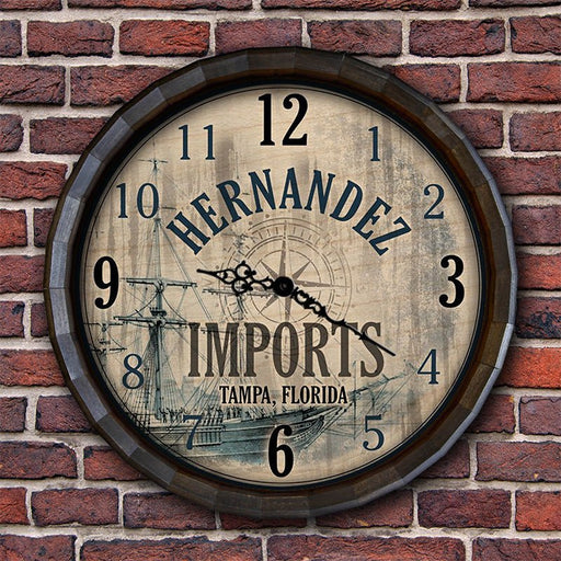 Wall clock with 'Hernandez Imports' branding on a brick wall background