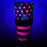 Neon pink flag shaker design glows under a black light